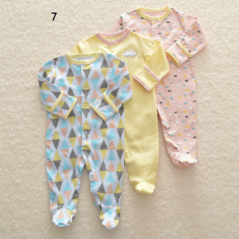 Drie nieuwe baby rompertjes met lange mouwen en voetjes