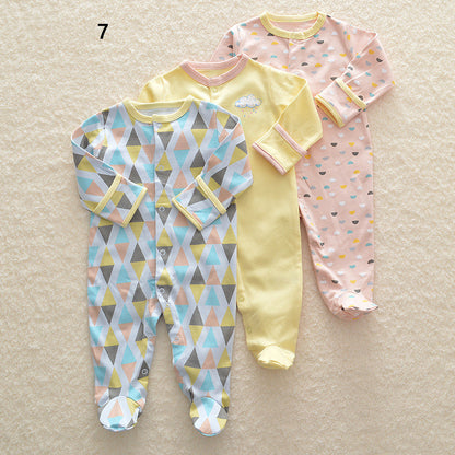 Drie nieuwe baby rompertjes met lange mouwen en voetjes