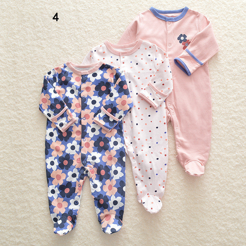 Drie nieuwe baby rompertjes met lange mouwen en voetjes