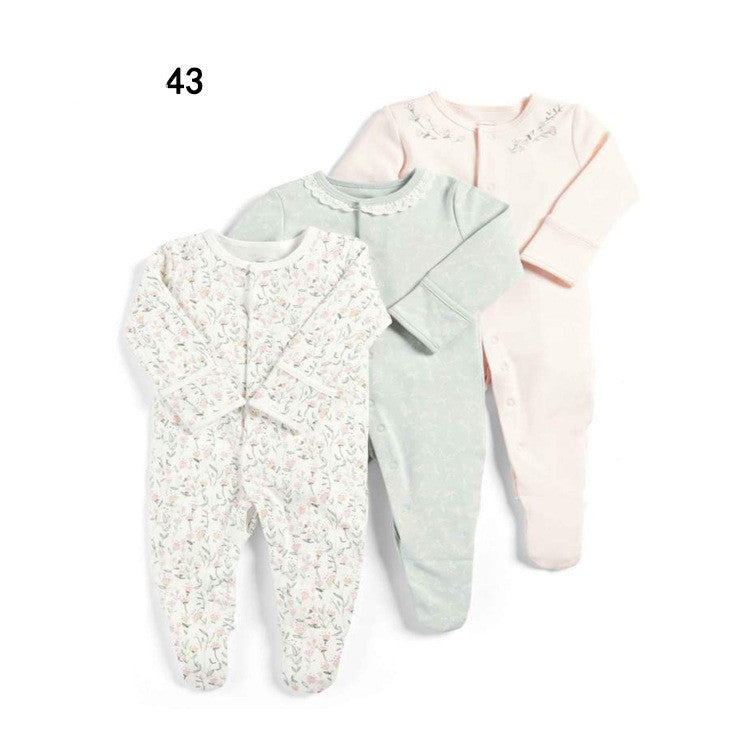 Drie nieuwe baby rompertjes met lange mouwen en voetjes