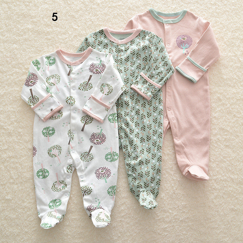Drie nieuwe baby rompertjes met lange mouwen en voetjes