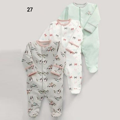 Drie nieuwe baby rompertjes met lange mouwen en voetjes